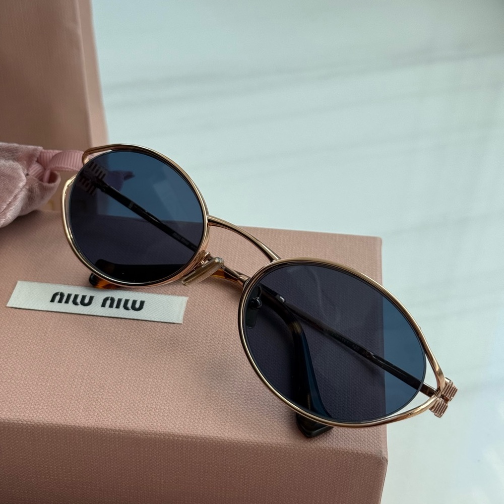 Miu Miu Gold Frame Round Sunglasses with Dark Blue Lenses